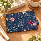 Love Always floral pouch laid flat on a wooden table in a warm lifestyle setting