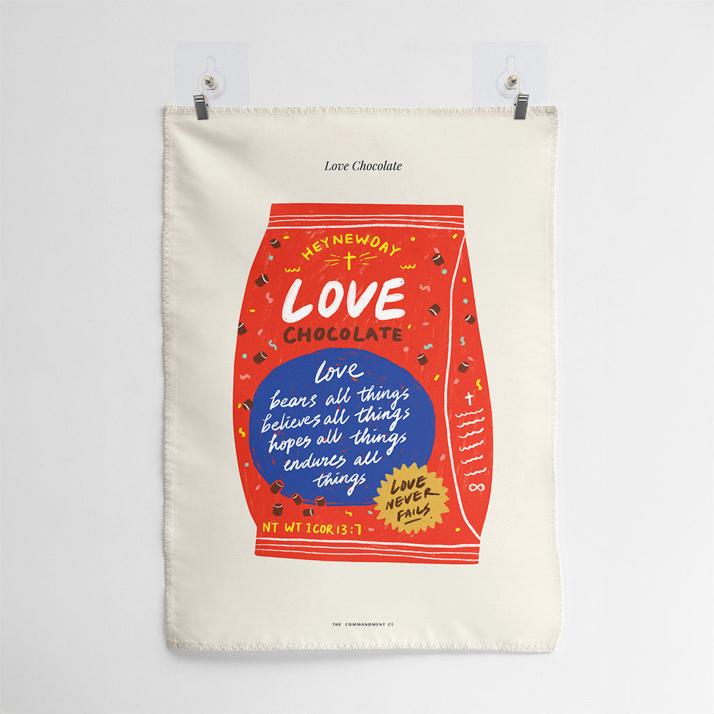 Creative wall tapestry design resembling a chocolate wrapper, featuring 1 Corinthians 13:7: 'Love bears all things, believes all things, hopes all things, endures all things,' with the message 'Love never fails,' inspiring faith and love.