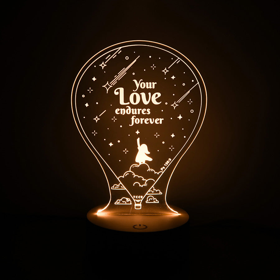 Christian inspirational lamp featuring 'Your love endures forever' with Psalm 136:9, designed with shooting stars and a silhouette of a girl reaching upward.