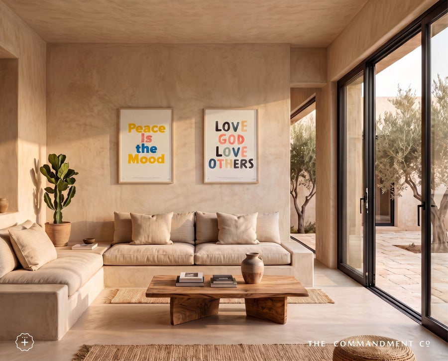 Love God Love Others and Peace Is the Mood posters displayed above a sofa in a warm living room
