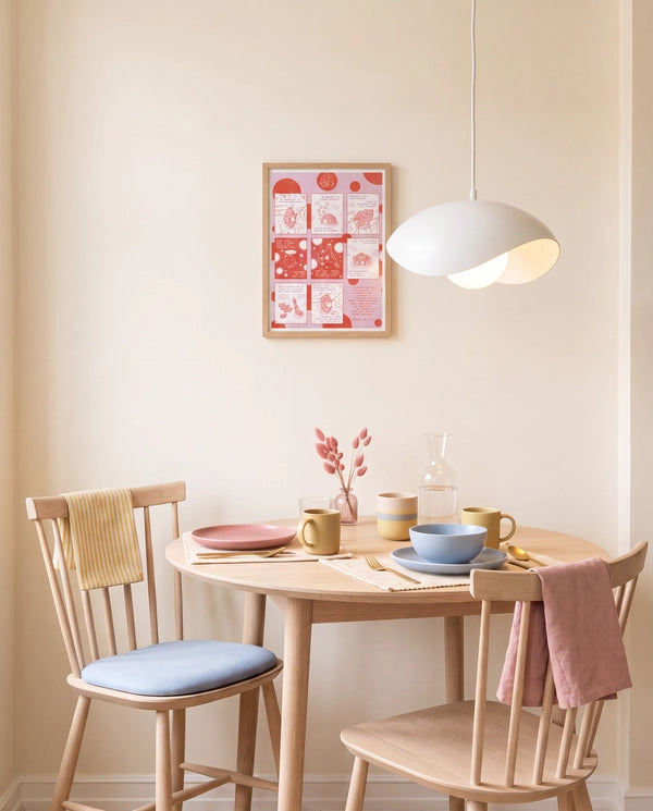 Love Has Brought Me Back Home pink and red Psalm 68:5–6 Christian poster displayed above a light wood dining table in a soft pastel dining room
