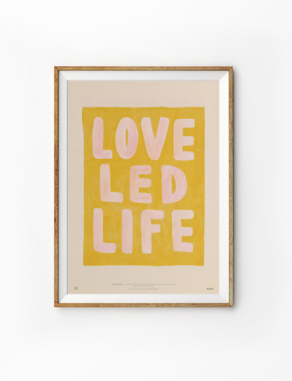 Love Led Life Christian poster inspired by 1 Corinthians 16:14 in a natural wood frame on a white background
