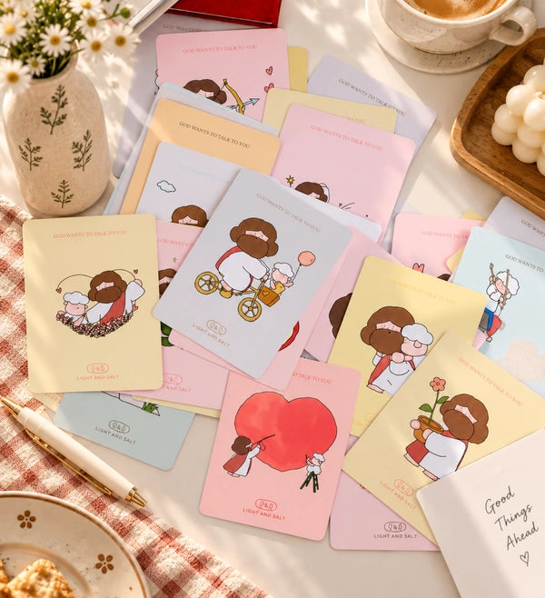 Lifestyle flatlay of Love Letters from Abba illustrated mini encouragement cards