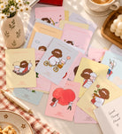 Lifestyle flatlay of Love Letters from Abba illustrated mini encouragement cards