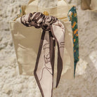 Christian-inspired Love Song faux-silk scarf shown as a versatile accessory.