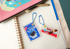 LOVE SUPERMARKET Christian acrylic keychains displayed together.