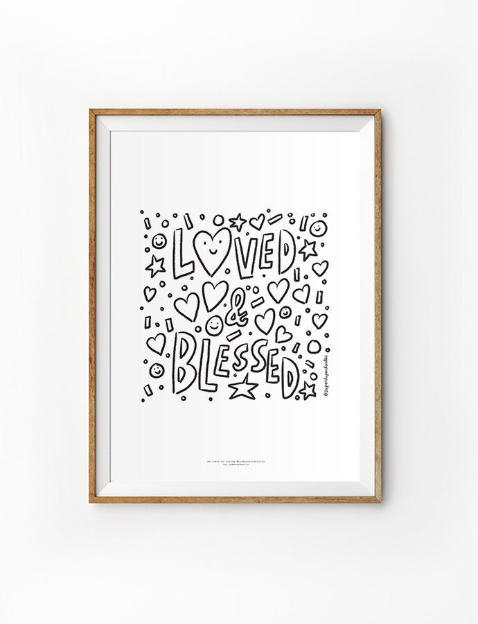 Playful framed art with 'Loved & Blessed' text surrounded by hearts, stars, and smiley faces