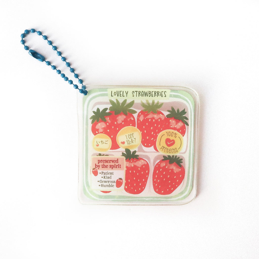 Keychain featuring vibrant strawberry illustrations with the message ‘Preserved by the Spirit’ and the verse 1 Corinthians 13:4-7, promoting patience, kindness, and humility.