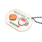 Acrylic keychain featuring "Match Made in Heaven" design with a biscuit and a cup of tea, from The Commandment Co, Singapore.