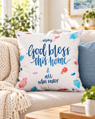 May God Bless This Home Christian cushion cover styled on a bright neutral sofa.