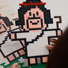 Micro building set of a joyful shepherd figure with a staff, crafted in pixel art style, inspiring hope and light while reflecting simple happiness and encouragement.