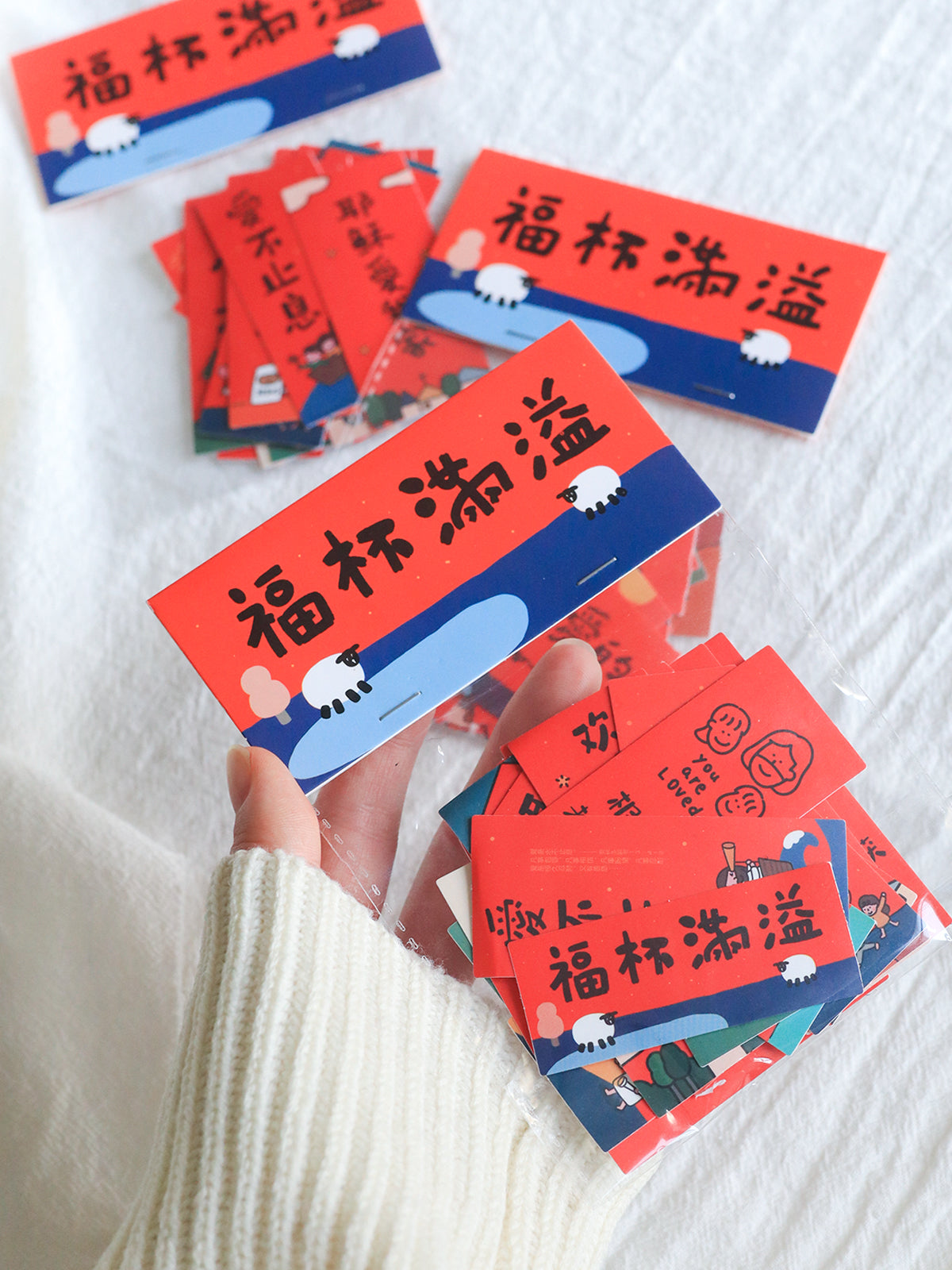 Mini Chinese New Year couplet sticker pack with festive red blessing designs and 24 removable PVC stickers.