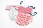 Heart-shaped acrylic keychain featuring the Bible verse John 15:7 in soft red tones, a Christian encouragement design in collaboration with moojigae_drawing.