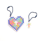 Acrylic keychains featuring a mosaic heart with a cross design, from The Commandment Co, Singapore.