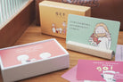 Set of mini Christian cards with Bible verses and illustrations displayed on a wooden surface
