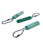 My Father’s Road Christian acrylic keychain shown with Singapore-inspired keychain designs.
