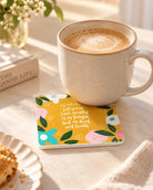 My Little Children floral Scripture coaster with white sides beneath a ceramic coffee mug on a sunlit breakfast table