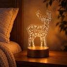My Soul Pants for You, My God deer night light glowing warmly on a bedside table.