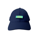A navy blue cap featuring a turquoise patch with yellow text reading "The Good Shepherd," a Christian-inspired accessory promoting faith and positivity.