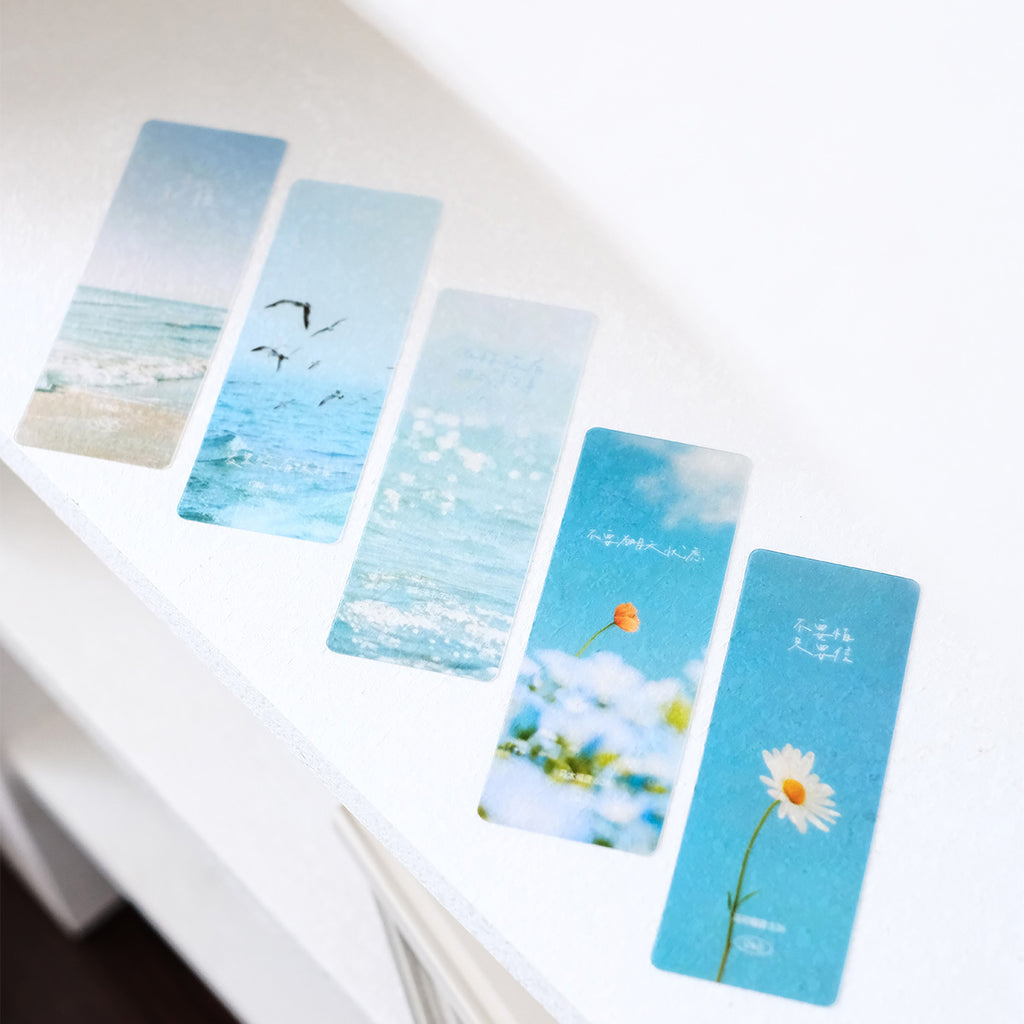 Five bookmarks showcasing ocean waves, flowers, and sky designs paired with Bible quotes, perfect for faith-inspired gifts and stationery.