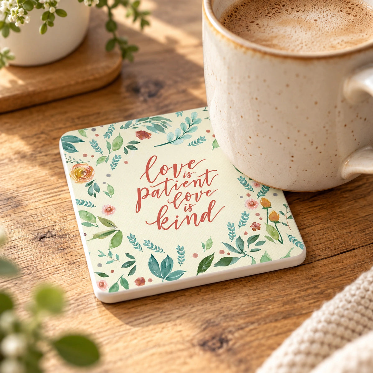 Love Is Patient Love Is Kind Christian coaster styled with a ceramic coffee mug in warm natural light