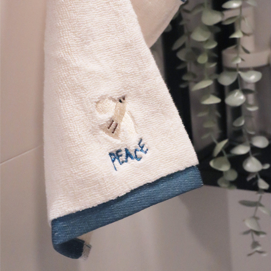 Peace Christian cotton towel with embroidered wording.