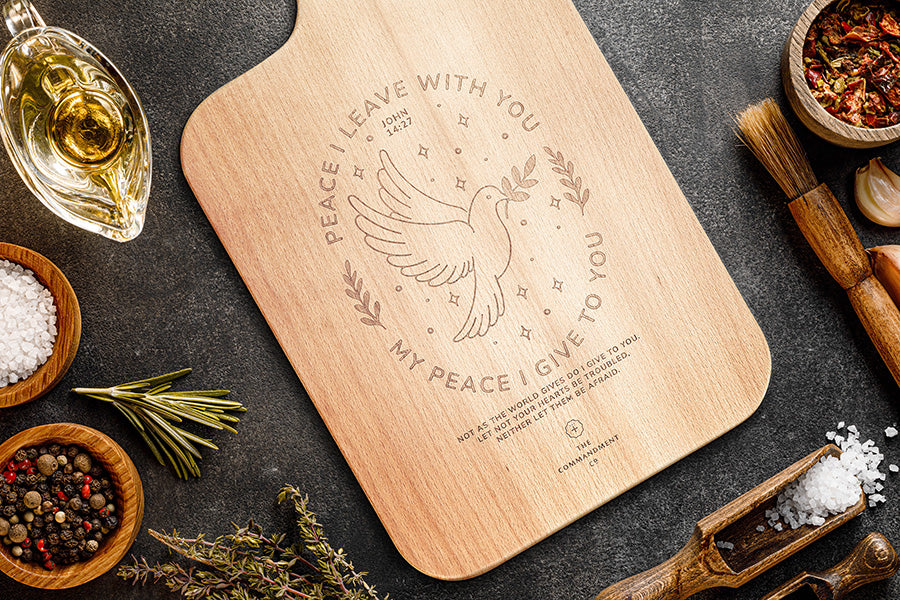 Peace I Leave With You Christian wooden cutting board styled in a lifestyle setting.