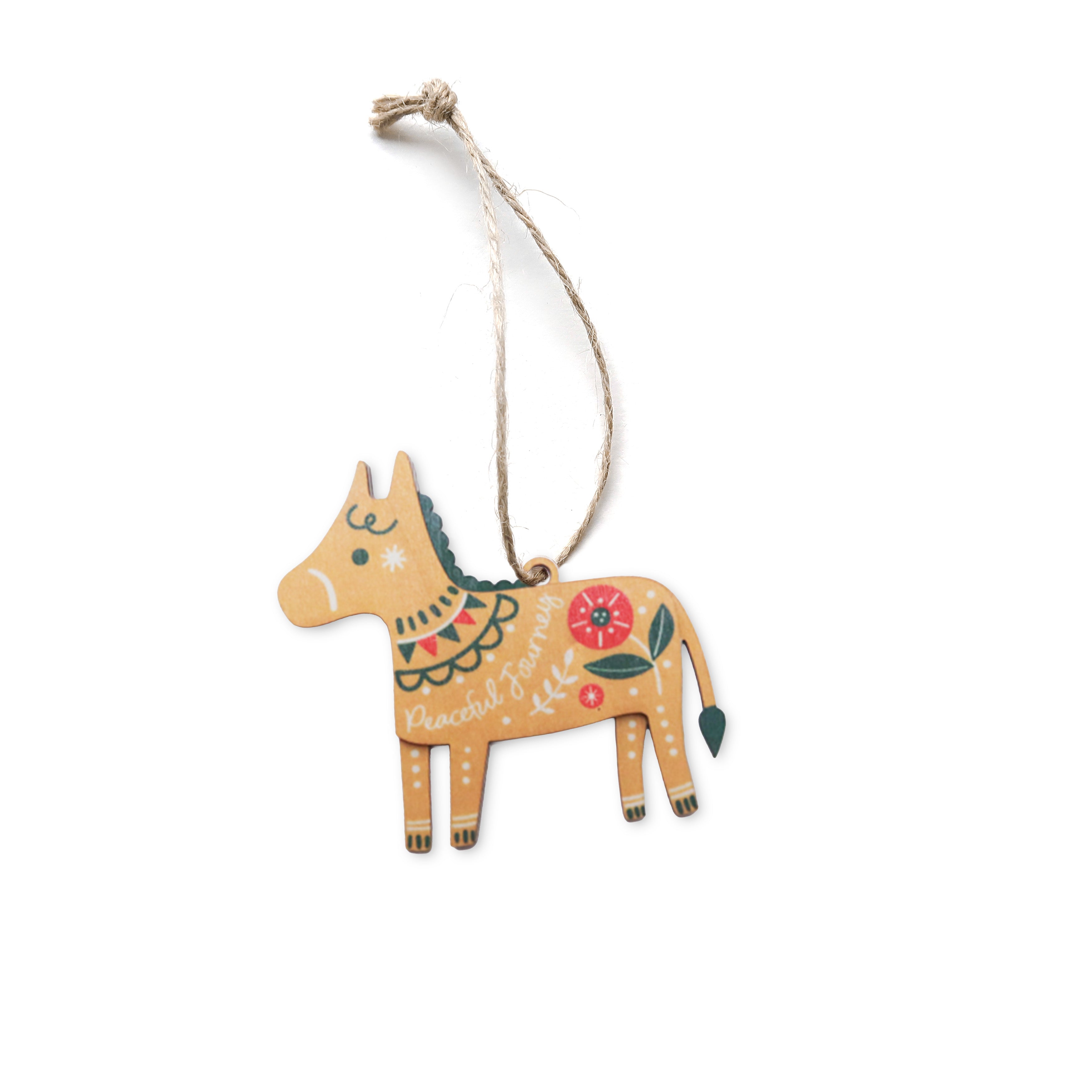 Donkey-shaped Christmas bauble with floral details and the words ‘Peaceful Journey’.