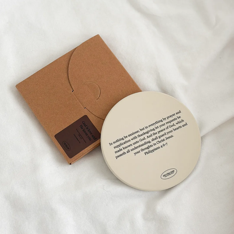 Non-absorbent ceramic coaster used as heat-resistant mat on desk