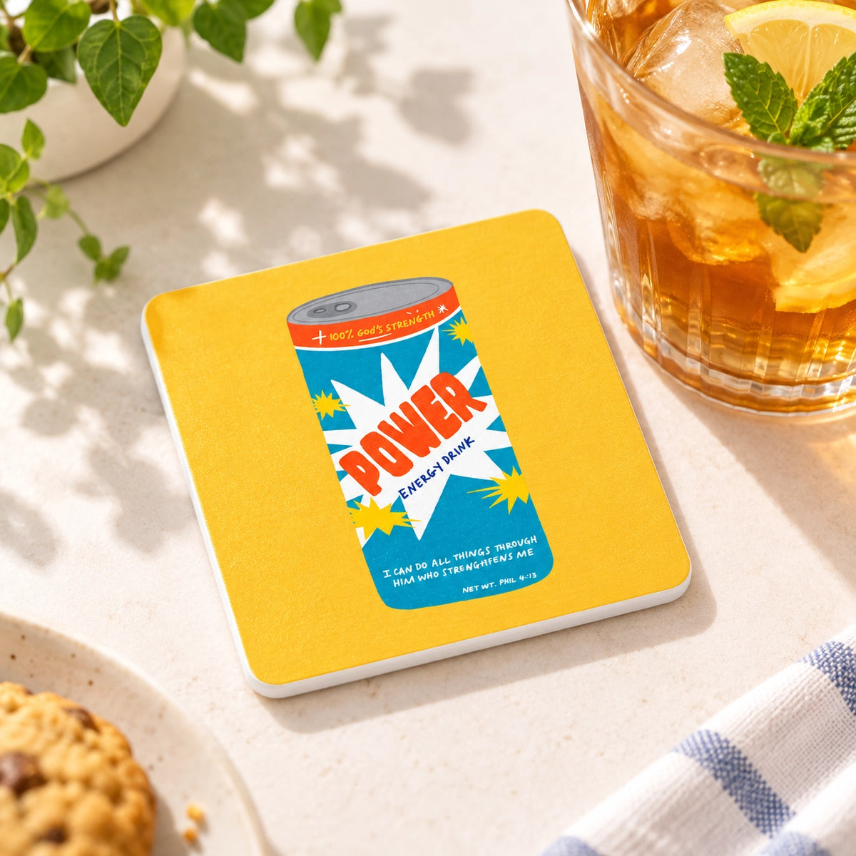 Power Energy Drink Christian coaster styled beside a chilled drink in warm natural sunlight