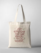 A faith-based Tote Bag featuring the Bible verse 'Let everything that has breath praise the Lord' in elegant handwritten typography. Surrounding the text are soft pastel-colored floral and leaf illustrations on a warm beige background. The Christian wall art is framed in a simple wooden frame, making it a meaningful piece for home decor, a prayer corner, or a worship space.