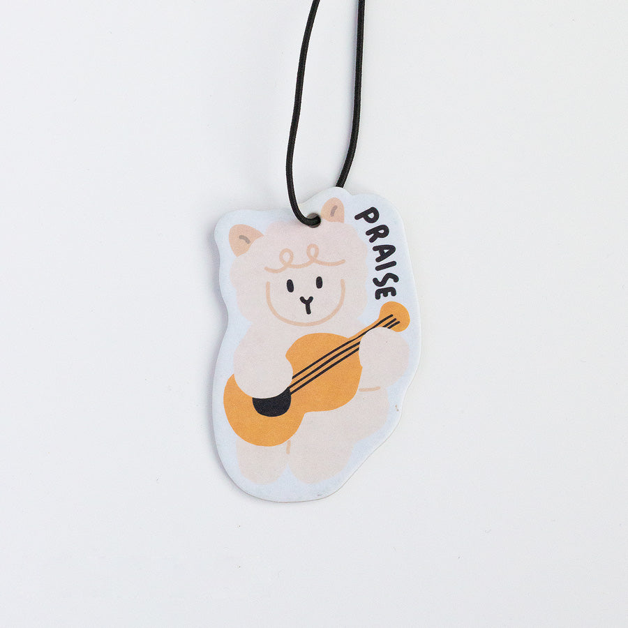 Praise the Lamb Christian car and room scent tag with sheep-and-guitar illustration.