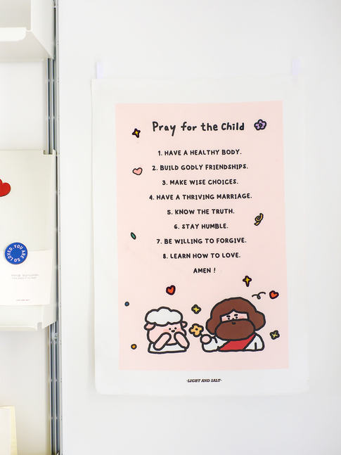 Faith-inspired "Pray for the Child" wall hanging with prayer list and cartoon Jesus and sheep