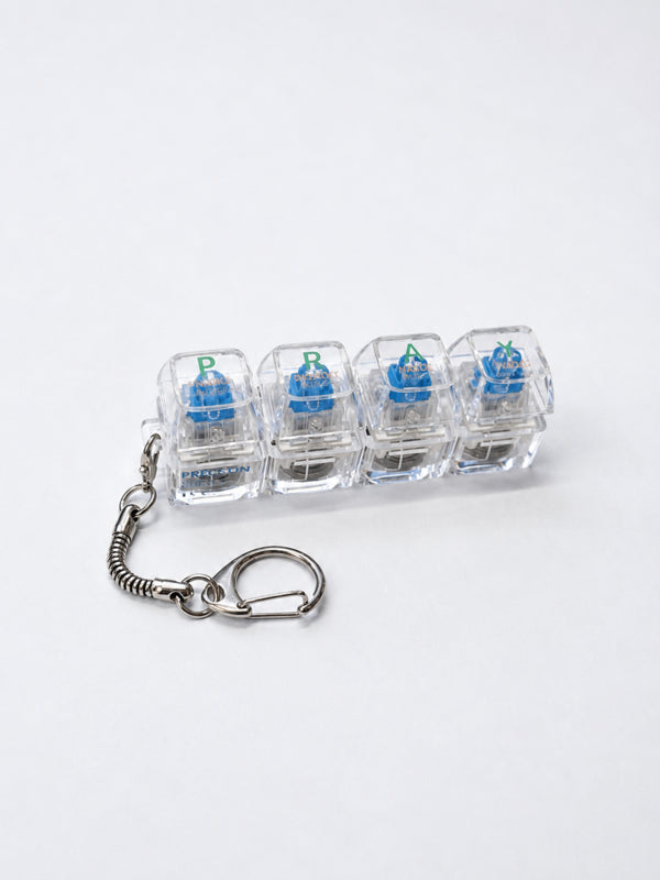 Clear PRAY light-up keycap keychain with four pressable keys