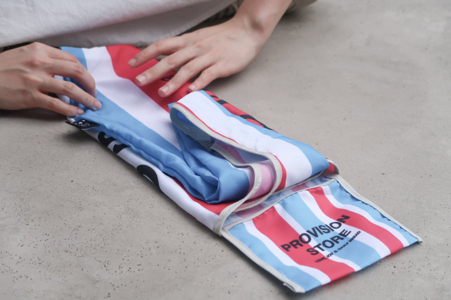 Provision Store Bible 
verse shopping bag being 
folded for compact 
storage, a practical and 
uplifting Christian gift from 
a Christian gift store. 