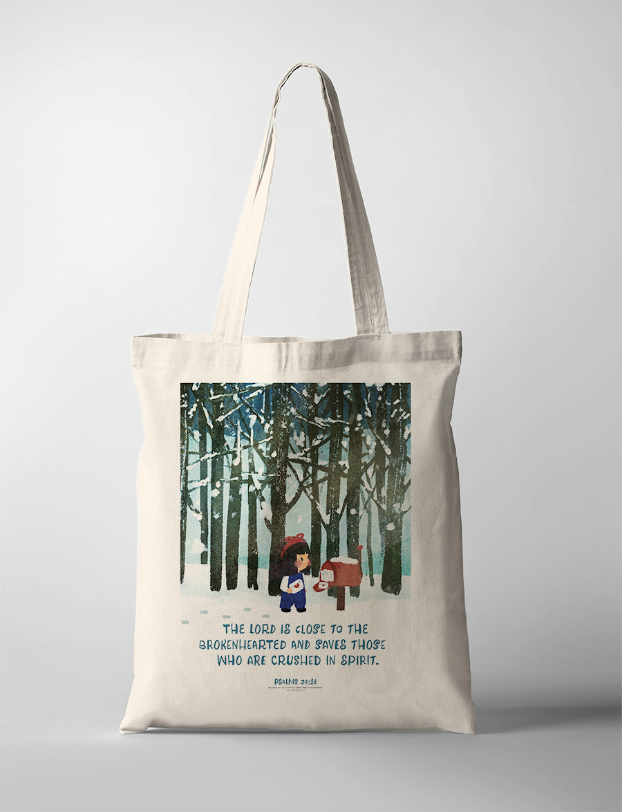 Christian tote bag with Psalm 34:18 “The Lord is close to the brokenhearted; He rescues those whose spirits are crushed,” winter forest illustration, comforting faith tote bag.
