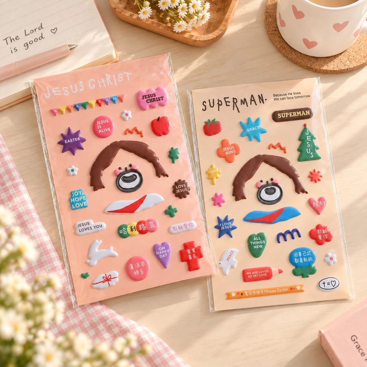 Puffy Jesus sticker sheets displayed on a bright desk with colourful Christian sticker designs and stationery.