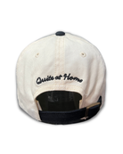 Back view of Love Unfairly cap with Quite at Home embroidery and adjustable strap