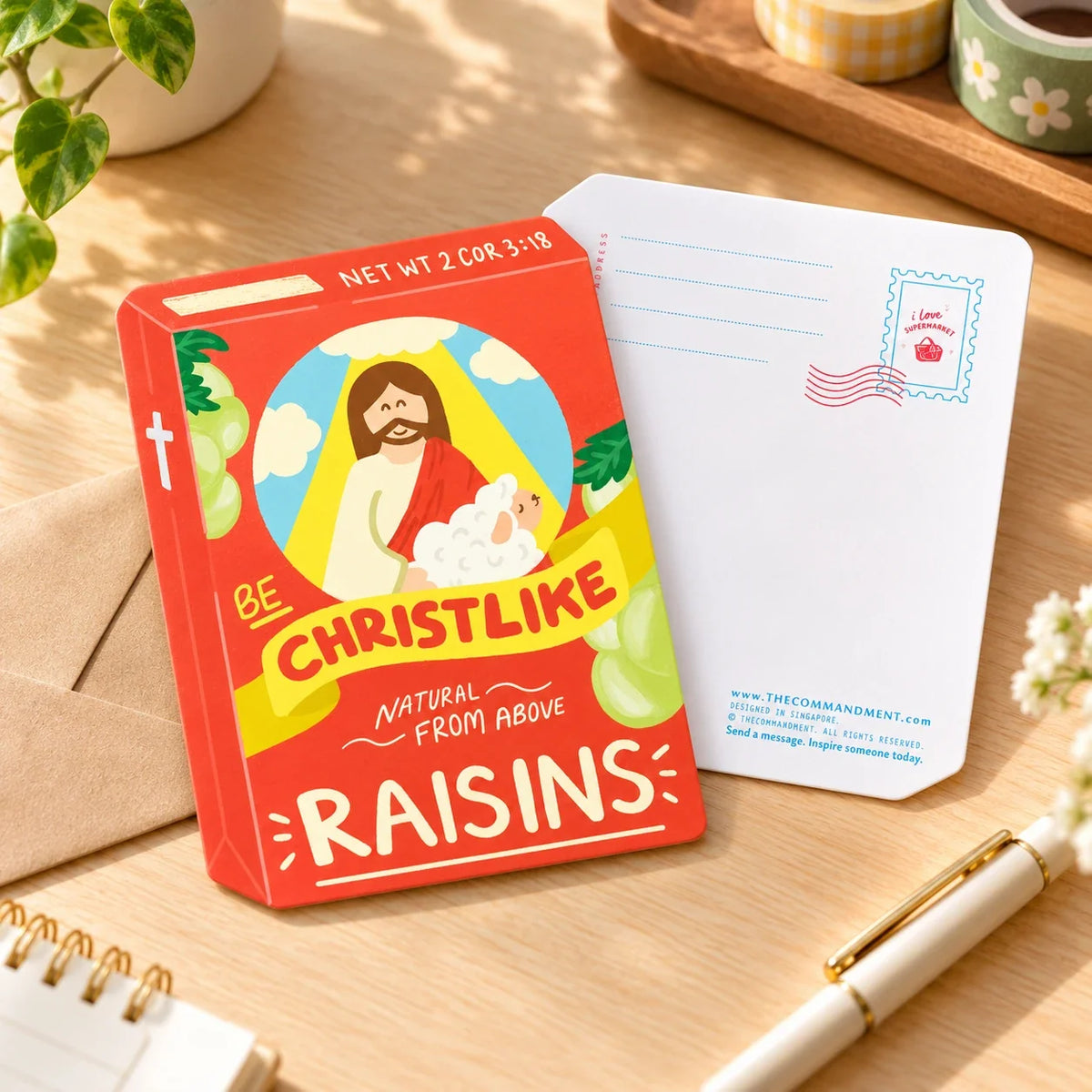 Raisins Christlike card front and back on warm wooden desk