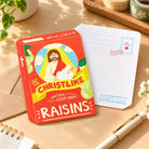 Raisins Christlike card front and back on warm wooden desk
