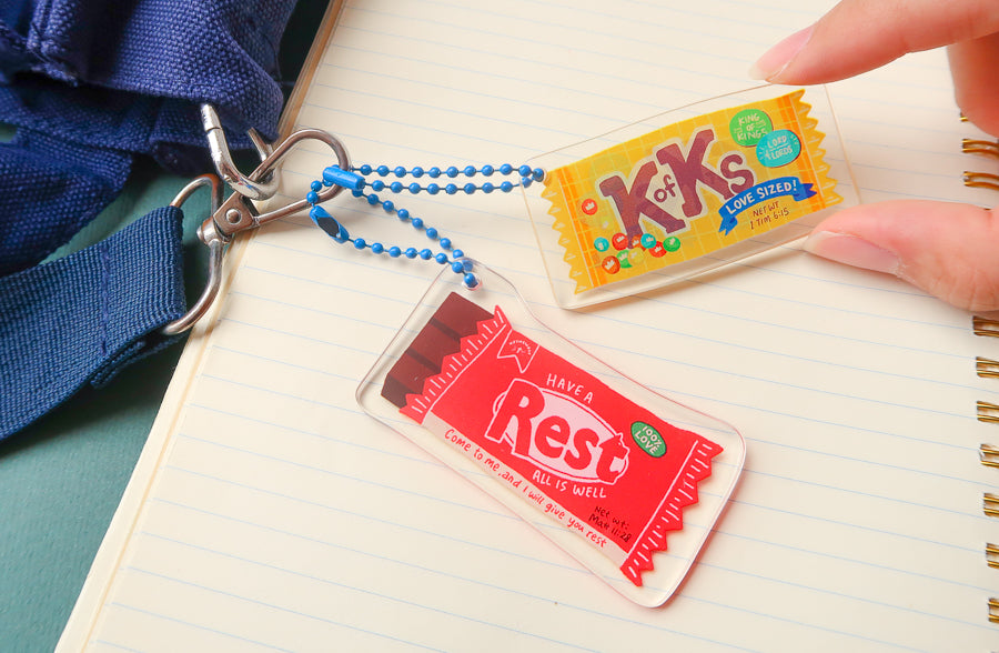 Christian-inspired Love Supermarket acrylic keychains shown together.