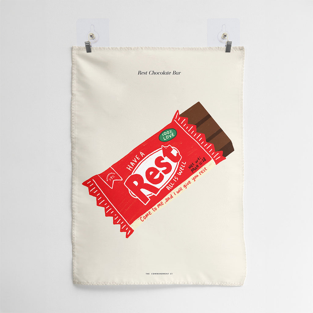 Wall tapestry featuring a chocolate bar design labeled 'Have a Rest' with the scripture Matthew 11:28, inviting to find rest in faith and offering a comforting and creative Christian-inspired decor.