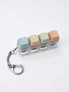 Pastel REST light-up keycap keychain with four pressable keys