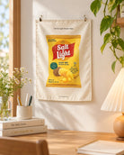 Salt & Light Potato Chips small wall tapestry clipped to a wall over a desk.