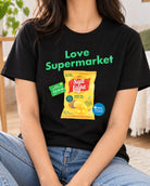 Lifestyle photograph of a woman wearing the black Love Supermarket Salt and Light Potato Chips T-shirt.