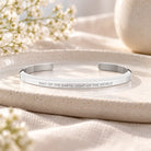 Salt of the Earth, Light of the World silver classic verse band styled on a ceramic tray.