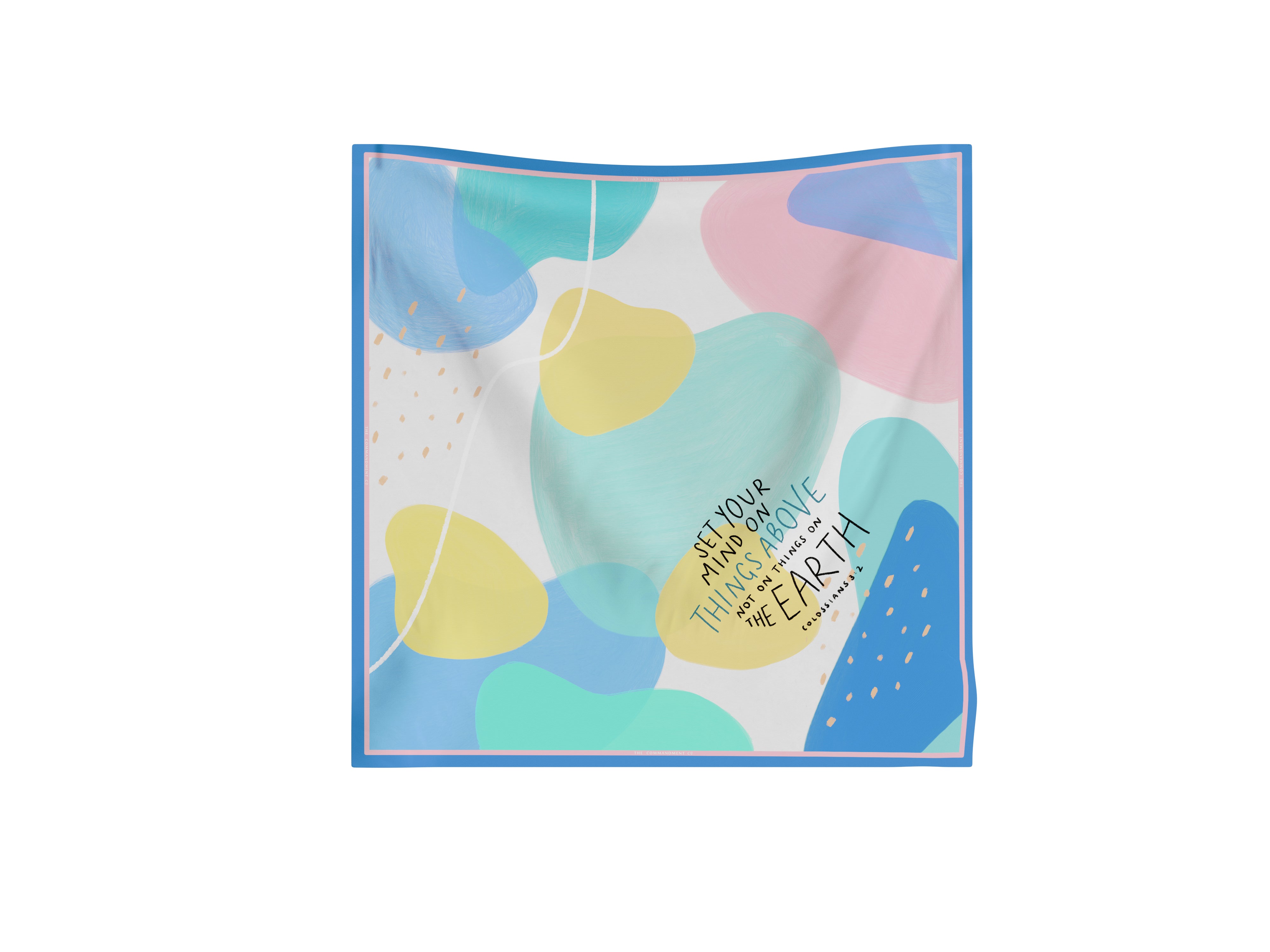 Colorful abstract scarf featuring the Colossians 3:2 verse “Set your mind on things above” in a modern Christian design by The Commandment Co.