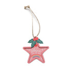 Pink star-shaped Christmas tree bauble with holly leaves and the word ‘Shine’.