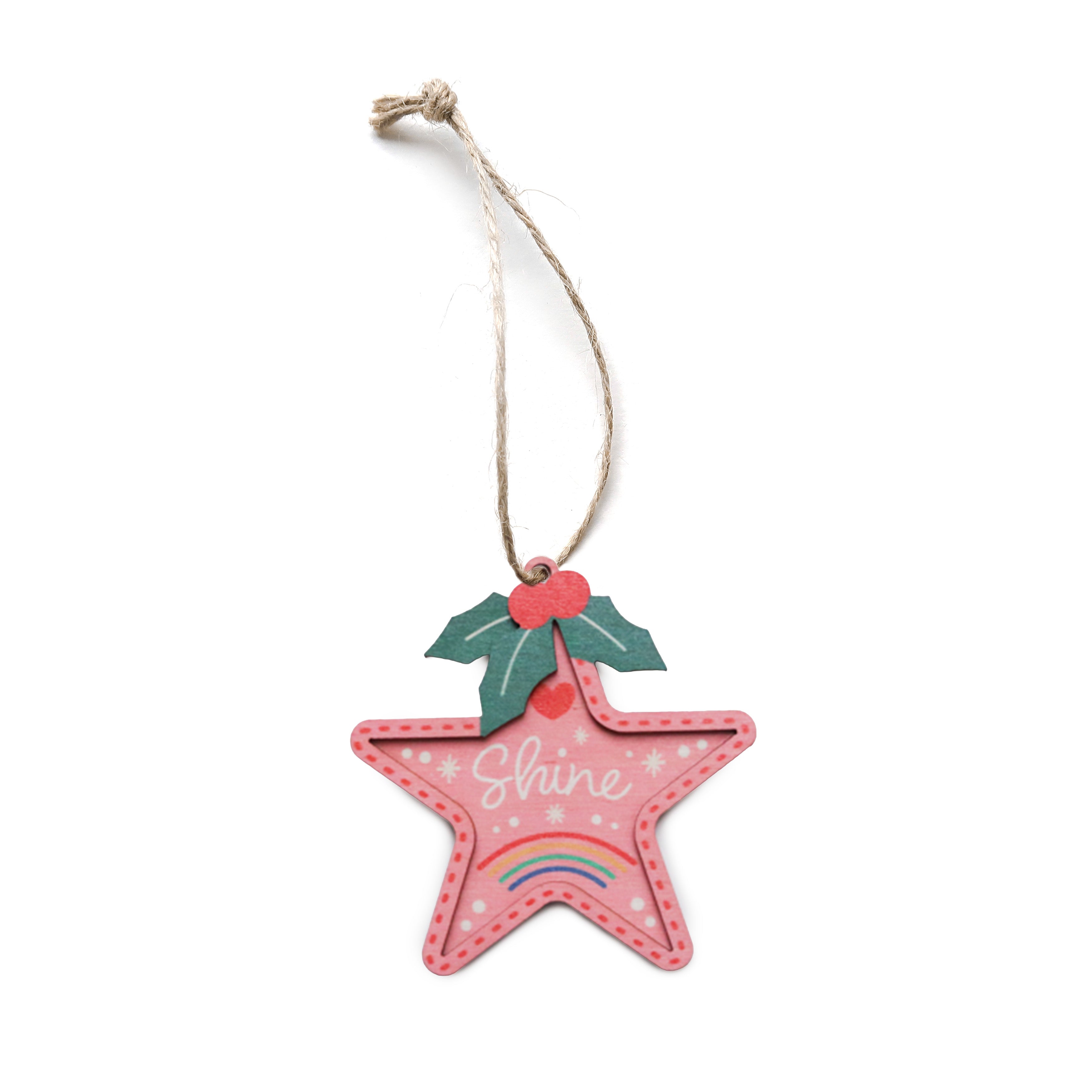 Pink star-shaped Christmas tree bauble with holly leaves and the word ‘Shine’.
