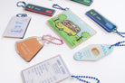 Singapore-inspired Christian acrylic keychain collection featuring Jesus Loves Me transport card, Grace and Love MRT sign designs, Abba Store receipt, and faith-filled reminders